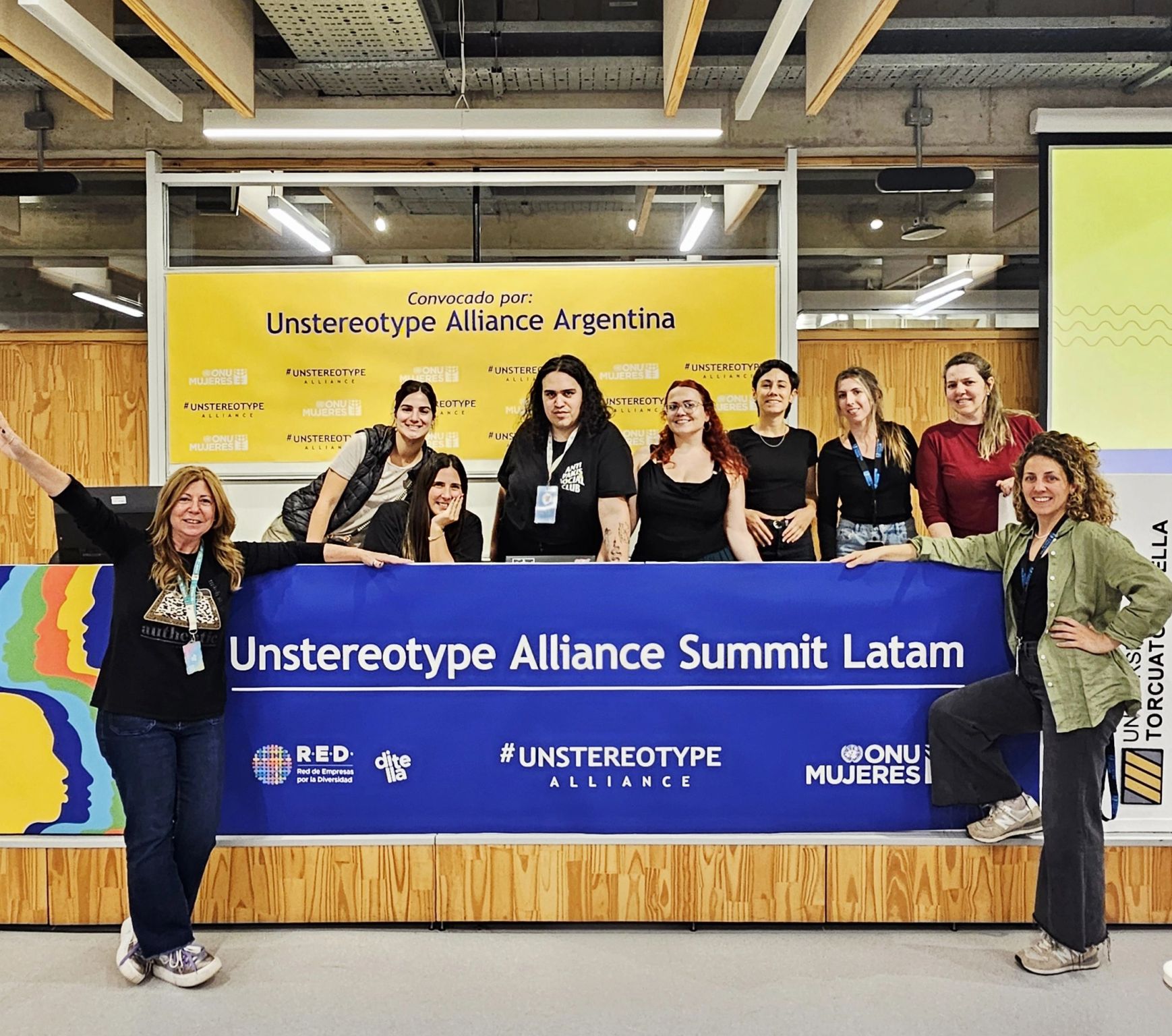 group picture in front of sign